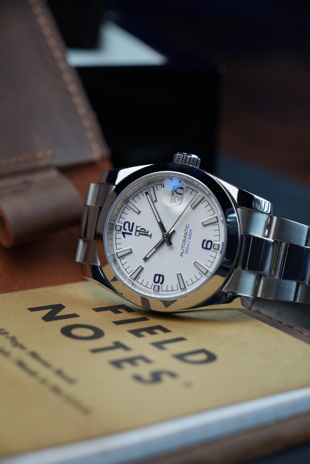 White-dial Terra watch on a field notebook